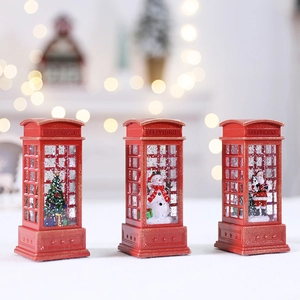Three red Christmas telephone booth lanterns with Santa, Snowman, and Tree figurines