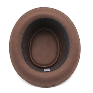 Close-up of brown wool fedora hat interior showing black sweatband and care label