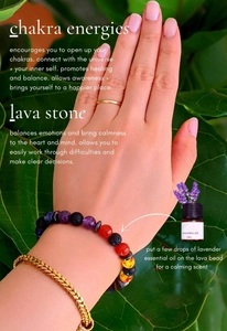 Chakra lava stone bracelet with lavender oil bottle shown on wrist with green leaves