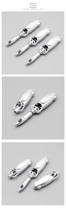 Mechanical folding ballpoint pen in silver metal showing retractable frog transformation