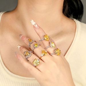 Luxury 925 sterling silver rings set with oval and pear-cut yellow zircon stones on hand