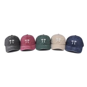 Washed cotton baseball caps with palm tree embroidery in five vintage faded colors