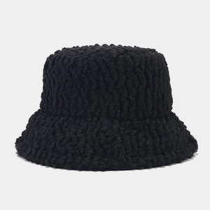Detail shot of the black sherpa bucket hat featuring a textured curly fleece material