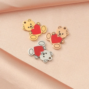 Three stainless steel bear pendants with red hearts in gold, rose gold and silver finish