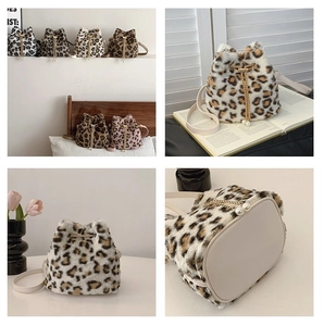 Detail of plush leopard print bucket bag featuring a pearl charm and drawstring closure