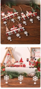 Detail of Christmas wooden signs with Santa, snowman and bells hanging on rustic twine