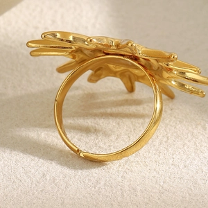 Macro shot of 18K gold plated stainless steel sunburst ring with a polished open band