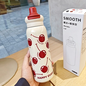 Detail of 316 stainless steel insulated bottle with red cherry print and packaging box