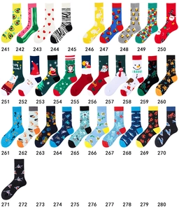 Flat lay display of colorful cotton socks with vibrant fruit and animal patterns