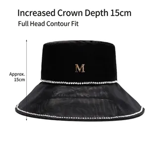 Black velvet bucket hat with mesh brim and rhinestone M logo showing 15cm depth