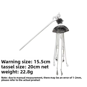 Detail of Chinese ink-style flower hair pin with long tassels and beaded accents