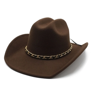 Detail of dark brown wool felt cowboy hat featuring a gold and black chain band decor