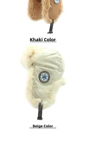 Detail of khaki and beige winter trapper hats with thick faux fur lining and ear flaps