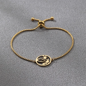 Detail of adjustable gold box chain bracelet with palm tree pendant and sliding clasp