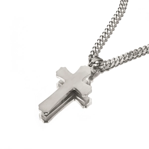 Detailed view of silver stainless steel double-layered cross pendant on Cuban chain