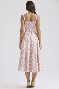 Detail of floral spaghetti strap midi dress back view showing fit and flowy fabric