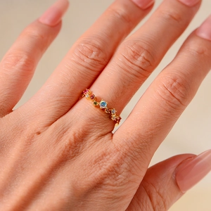 Detailed view of colorful zircon stones on a gold-plated sterling silver open ring