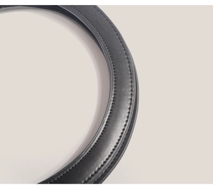 Close-up of premium black leather strap with fine textures and neat stitching details