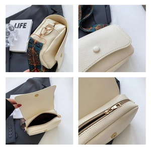Detailed views of white leather crossbody bag with wide strap and golden hardware