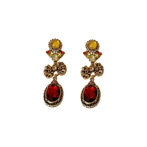 Vintage gold bow earrings with red and yellow gems on a clean white background
