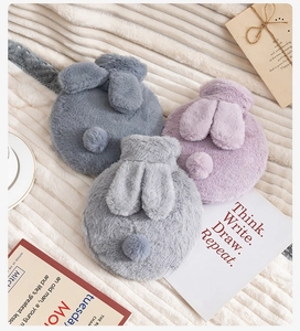 Three plush rabbit water bottle covers in blue, purple, and grey with cute ears and tails