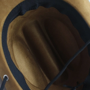 Internal view showing sweatband, black windproof cord and metal eyelet on camel suede hat