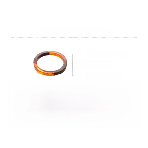 Detail view of round resin bangle showing wood chip inlay and dimensions of 7.9cm