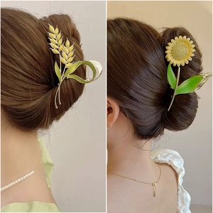 Elegant gold metal hair claw clips featuring sunflower and wheat ear floral designs
