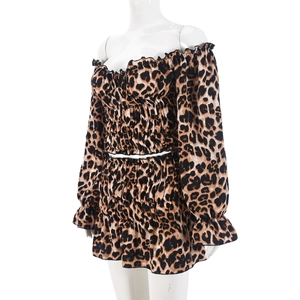 Detail of leopard print two-piece set featuring ruched texture and off-shoulder design