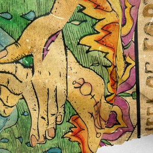Close-up of bohemian tarot tapestry fabric with mystical hand and floral print details