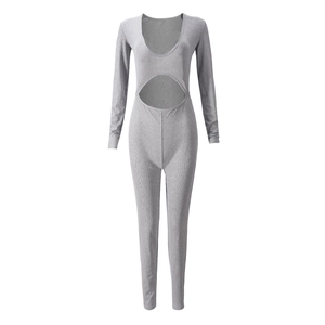 Detailed view of gray ribbed long sleeve jumpsuit with waist cut-out and snug fit