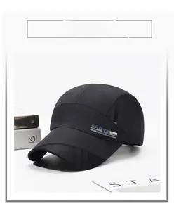 Detail of black quick-dry sports cap with breathable mesh and metal SPORTS logo