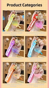 Close-up of six colorful luminous lollipop keychains with silicone Good Luck straps