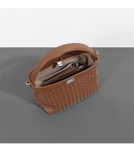 Detailed macro view of woven brown leather texture and inner zipper pocket compartment