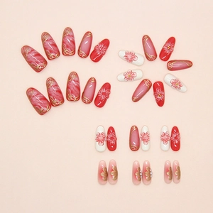 Macro detail of almond press-on nails with golden lines, marble texture and 3D floral art