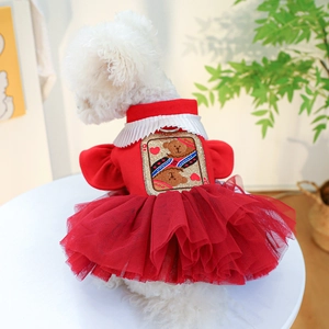 Detail of red pet wedding dress with mesh skirt, embroidery, and integrated D-ring