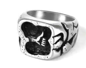 Macro view of vintage punk stainless steel ring with embossed gesture design on silver band