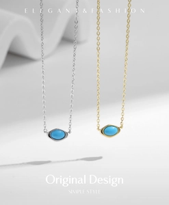 Macro detail of gold and silver S925 sterling silver necklaces with turquoise pendants