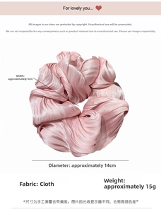 Detail showing dimensions of pink satin scrunchie with shiny pleated fabric texture
