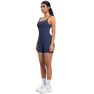 Side view of navy blue high-stretch yoga bodysuit with slim straps and tight fit