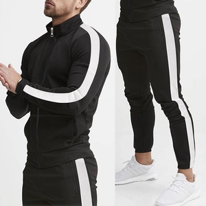Detail view of black tracksuit with white side stripes and ribbed zipper collar jacket