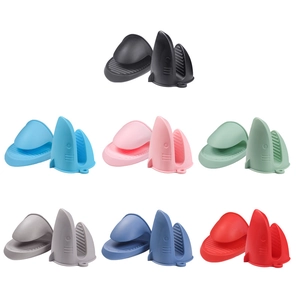 Shark-shaped silicone heat resistant oven mitts in seven vibrant colors for kitchen use