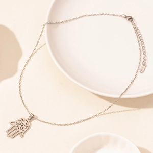 Detailed close-up of a silver stainless steel Hamsa Hand pendant with adjustable chain