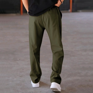 Back view of men's loose straight casual pants in olive green with a comfortable fit