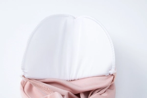 Close-up of internal built-in chest pads and high-density stitching on evening dress