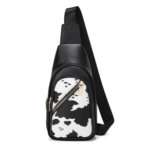 Detailed view of trendy cow print chest bag with荔枝纹 PU leather and metal zippers