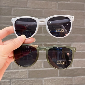 Detail of UV400 protection and CE certification markings on kids' foldable sunglasses