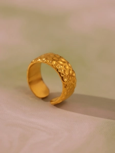 Detailed view of hammered texture on vintage gold adjustable open ring for women