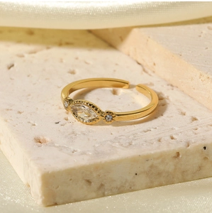 Detail of adjustable gold ring with marquise-cut zircon set on elegant stone props