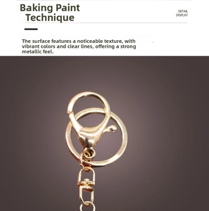 Detail view of golden alloy lobster clasp with smooth paint finish and metallic luster